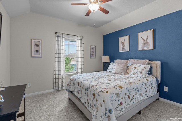 bedroom featuring baseboards, vaulted ceiling, and carpet