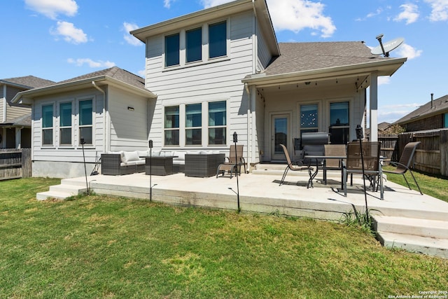 back of house featuring roof with shingles, fence, a patio area, a yard, and an outdoor living space