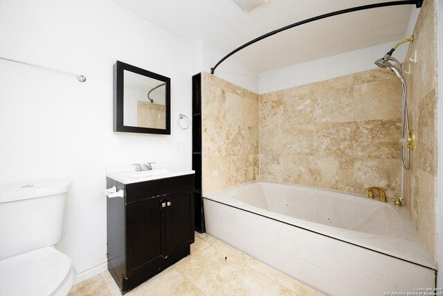 bathroom with vanity, toilet, a combined bath / shower with jetted tub, and tile patterned floors