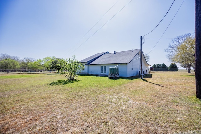 view of side of property featuring a yard