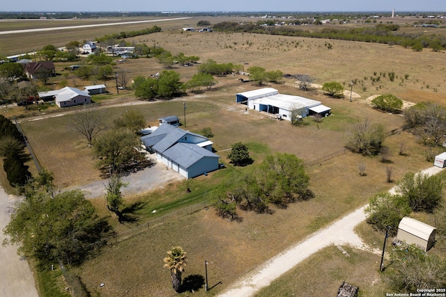 birds eye view of property featuring a rural view