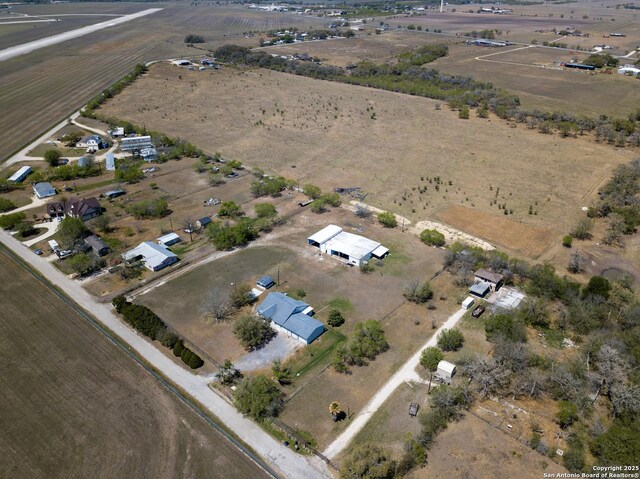 birds eye view of property featuring a rural view