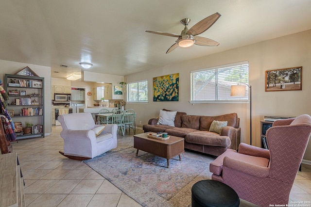 324 Craddock, San Marcos, TX 78666 - living room featuring a ceiling fan and light tile patterned floors