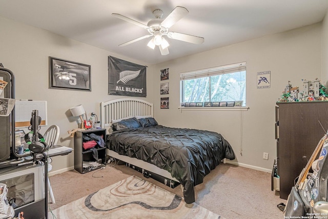 324 Craddock, San Marcos, TX 78666 - carpeted bedroom with ceiling fan and baseboards