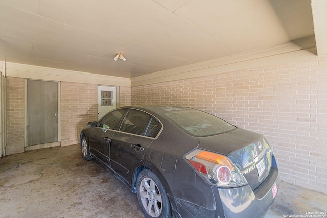 324 Craddock, San Marcos, TX 78666 - garage featuring a carport