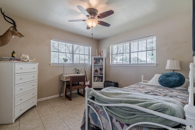 324 Craddock, San Marcos, TX 78666 - bedroom featuring baseboards, ceiling fan, and light tile patterned flooring