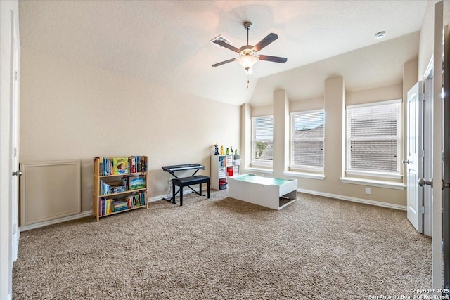recreation room featuring ceiling fan, carpet floors, lofted ceiling, and baseboards