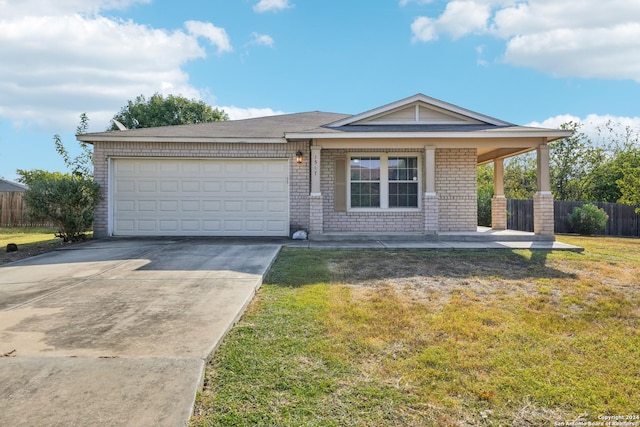ranch-style house featuring brick siding, fence, a garage, a front lawn, and concrete driveway