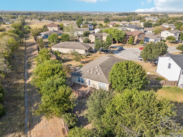 birds eye view of property with a residential view