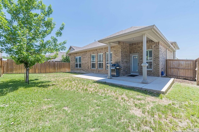 2004 Pillard Smt, San Antonio, TX 78245 - rear view of property with brick siding, a patio, and roof with shingles