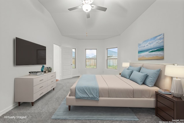 bedroom featuring ceiling fan, vaulted ceiling, carpet floors, and baseboards