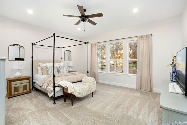 carpeted bedroom featuring ceiling fan, baseboards, and recessed lighting