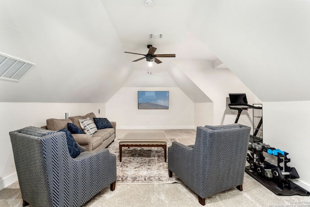living area featuring vaulted ceiling, a ceiling fan, visible vents, and baseboards
