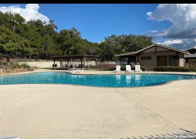 pool featuring a patio area