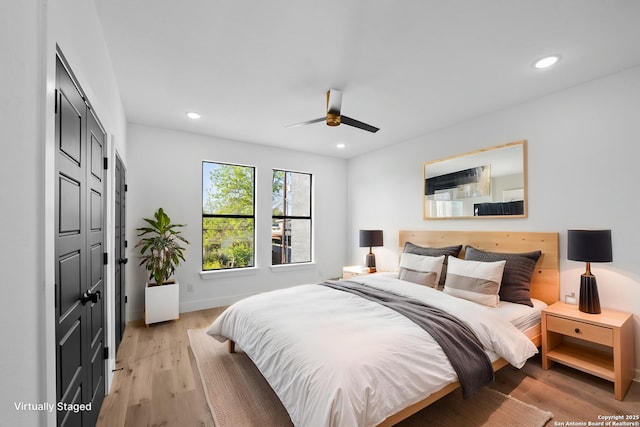 bedroom with ceiling fan, recessed lighting, baseboards, and light wood-type flooring