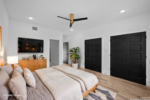 bedroom with recessed lighting, a ceiling fan, visible vents, and light wood-type flooring