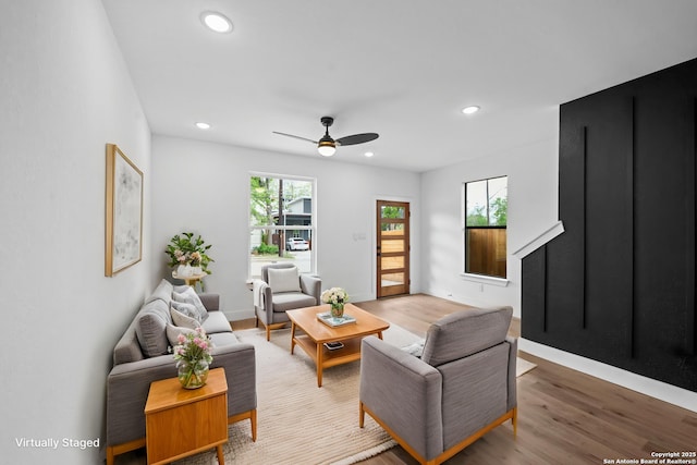 living room featuring baseboards, a ceiling fan, wood finished floors, and recessed lighting