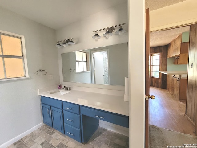 bathroom featuring vanity and baseboards
