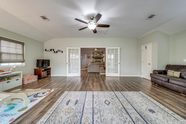 living area with french doors, wood finished floors, and visible vents