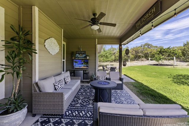 view of patio featuring an outdoor living space with a fire pit and ceiling fan