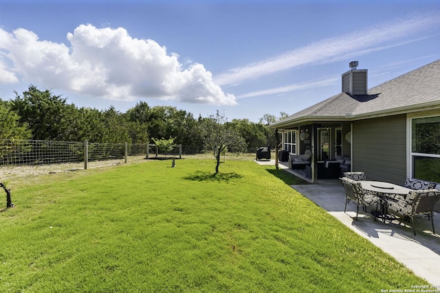 view of yard with fence and a patio area