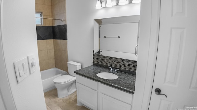 full bath featuring vanity, toilet, bathing tub / shower combination, and tasteful backsplash