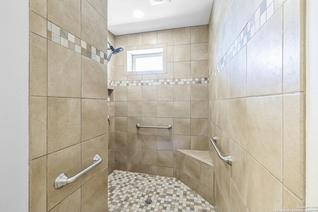 full bathroom with a tile shower