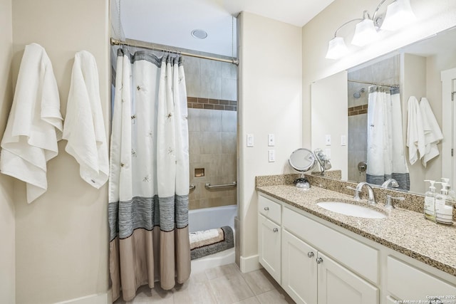 full bath featuring tile patterned flooring, shower / bathtub combination with curtain, vanity, and baseboards