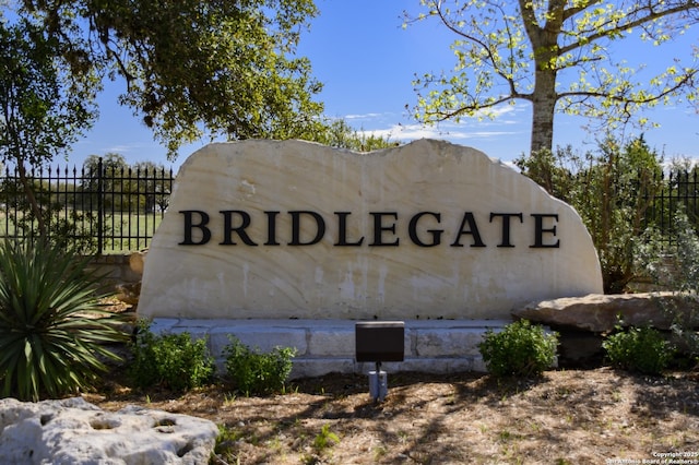 community sign with fence