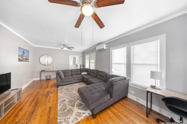 living room featuring a wall mounted air conditioner, ceiling fan, baseboards, and wood finished floors
