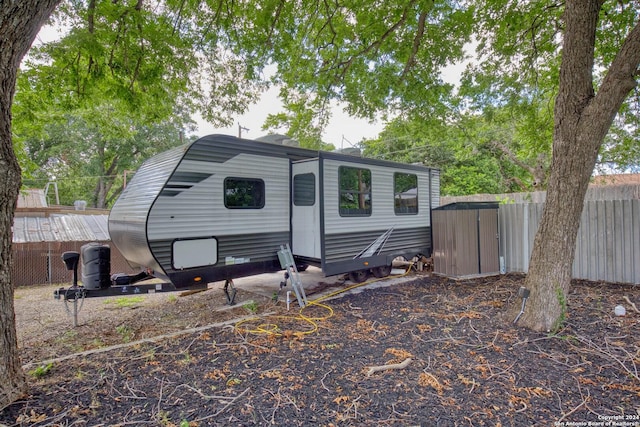 view of shed with fence