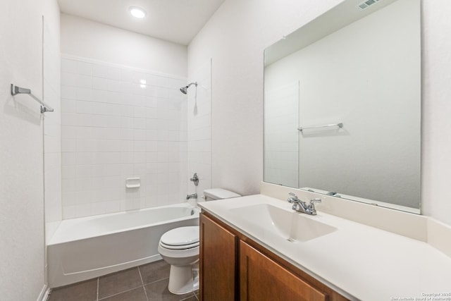 bathroom with vanity, tile patterned flooring, shower / bathing tub combination, and toilet