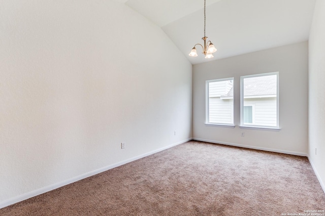 carpeted empty room with baseboards, a notable chandelier, and vaulted ceiling