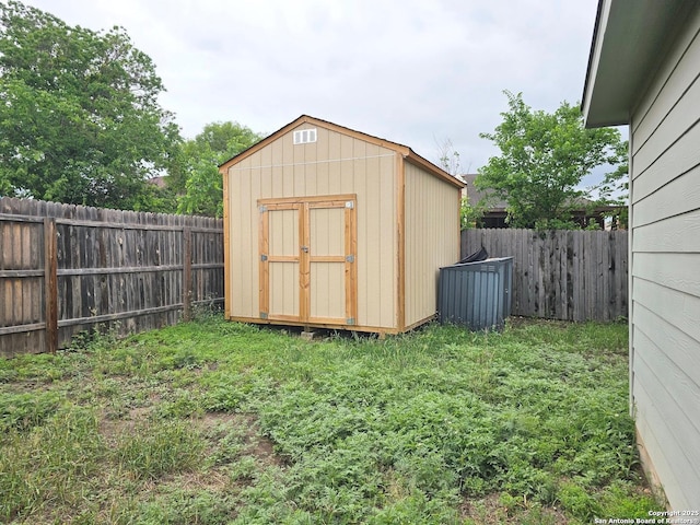 view of shed featuring a fenced backyard