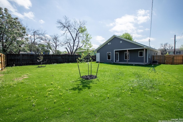 227 Quentin, San Antonio, TX 78201 - view of yard featuring central air condition unit and a fenced backyard