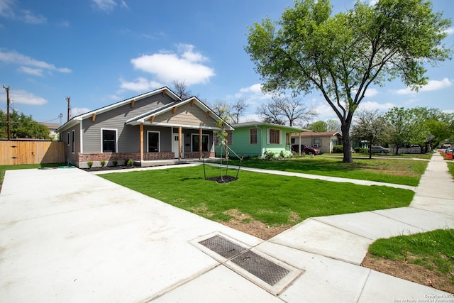 227 Quentin, San Antonio, TX 78201 - craftsman house with a front lawn, brick siding, and a porch