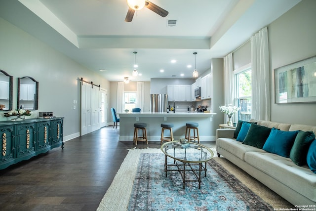 227 Quentin, San Antonio, TX 78201 - living room featuring plenty of natural light, a ceiling fan, visible vents, and dark wood-style flooring