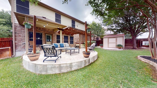 view of yard with a patio area, a storage shed, outdoor lounge area, a fenced backyard, and an outbuilding