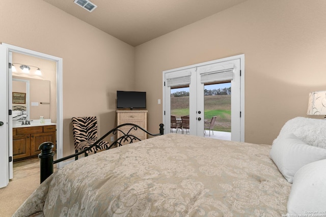 bedroom featuring visible vents, access to exterior, vaulted ceiling, light carpet, and french doors
