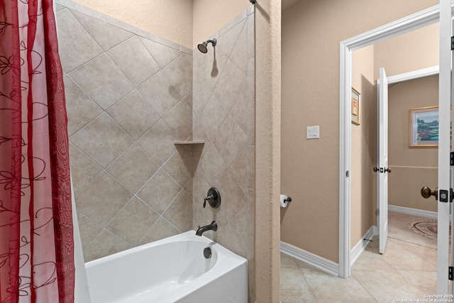 bathroom with shower / bath combination with curtain and tile patterned flooring