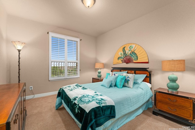 bedroom featuring baseboards and carpet flooring