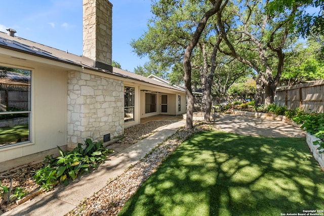 view of yard with a patio and fence