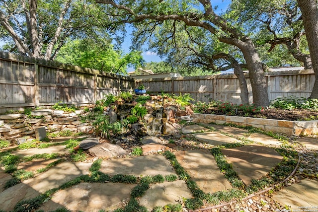 view of yard with a fenced backyard