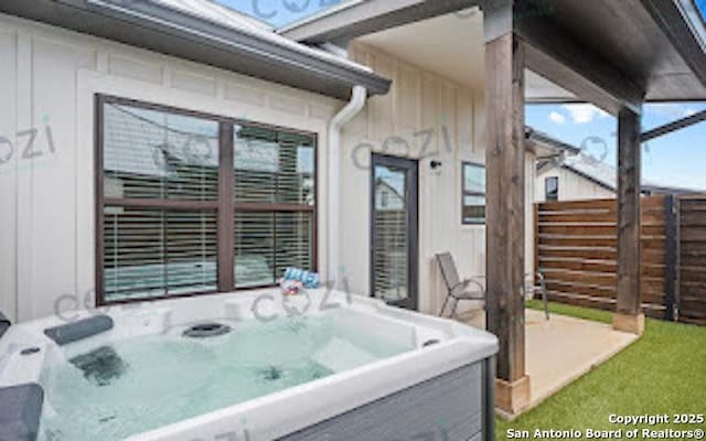 930 S Eagle St Unit 104, Fredericksburg, TX 78624 - view of patio / terrace with a hot tub and fence