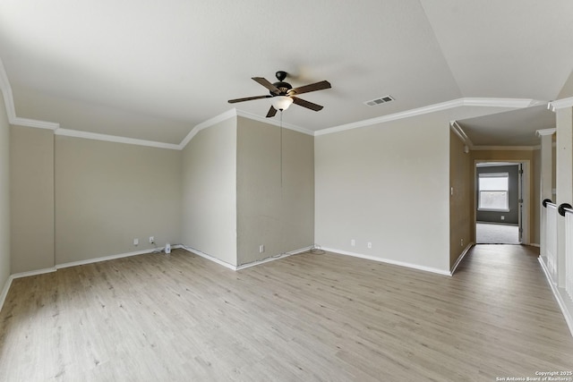 unfurnished room featuring visible vents, a ceiling fan, light wood-style floors, crown molding, and baseboards