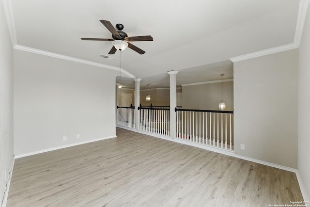 spare room with wood finished floors, visible vents, crown molding, baseboards, and ceiling fan with notable chandelier