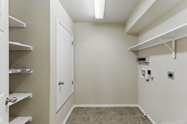 washroom with washer hookup, baseboards, electric dryer hookup, and laundry area