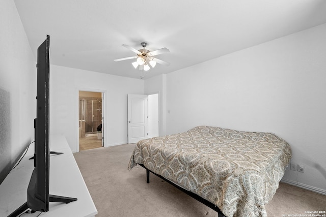 carpeted bedroom featuring ensuite bath and ceiling fan