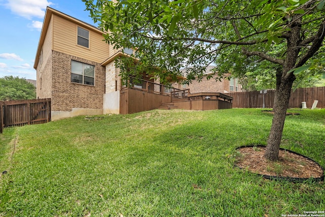 view of yard with stairway and a fenced backyard