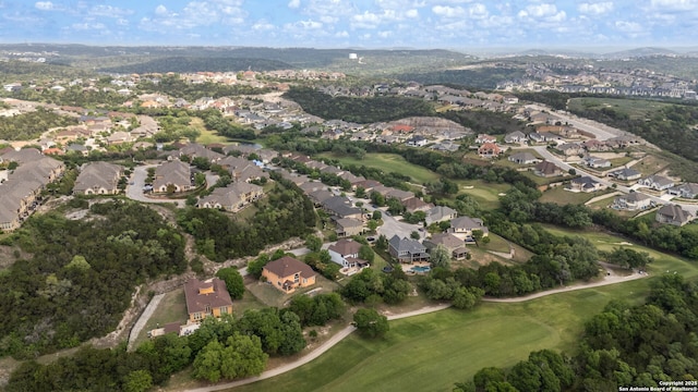 drone / aerial view with a residential view and golf course view